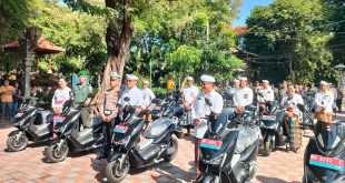 Babinsa Dangin Puri Atensi Penyerahan Sepeda Motor Listrik